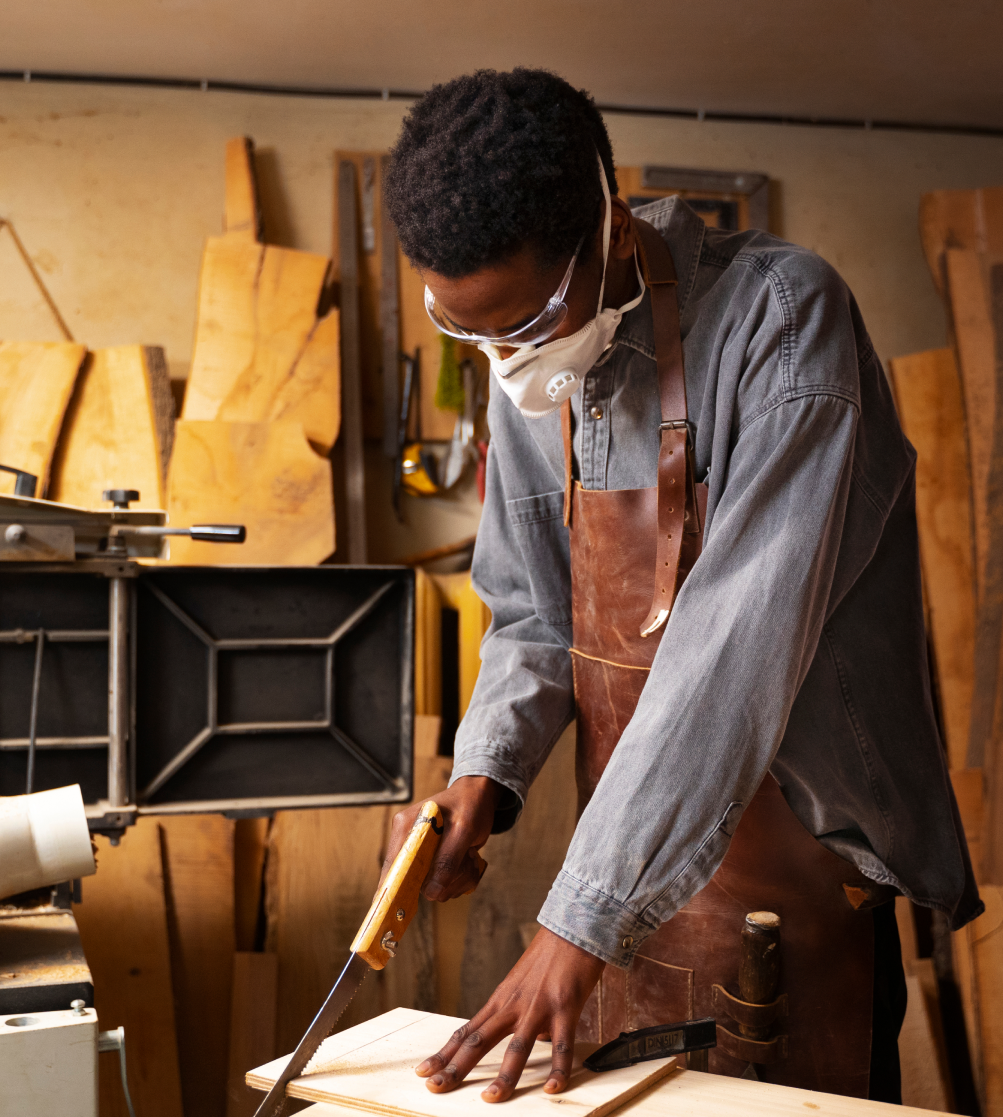 A man cutting with a saw